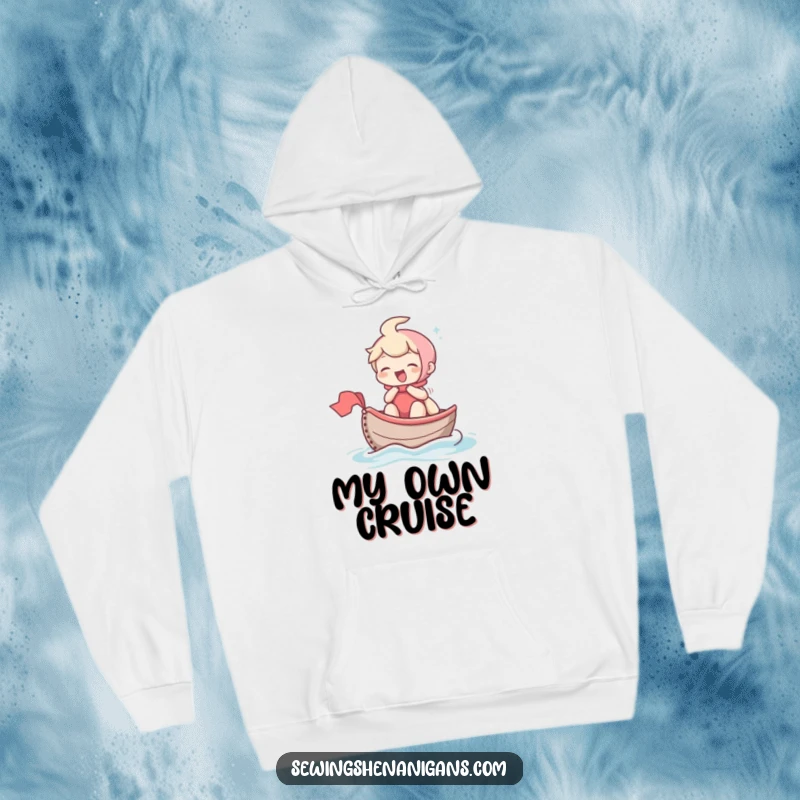 Funny hoodie depicting a laughing character sailing a thimble-boat across fabric, embodying a spirit of tiny adventures and cheerful exploration.