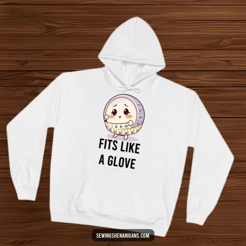 Funny Hoodie: A round measuring tape character joyfully wrapping around a perplexed button, great for garment makers.