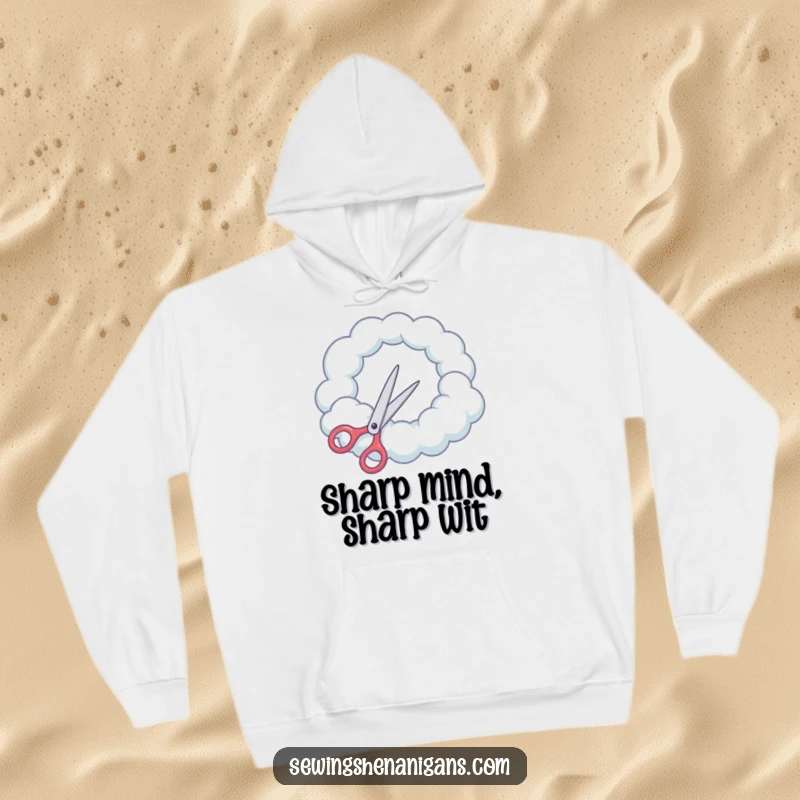 Funny Hoodie: Scissors attempt to cut a round hole in a cloud, bringing cozy surreal humor.