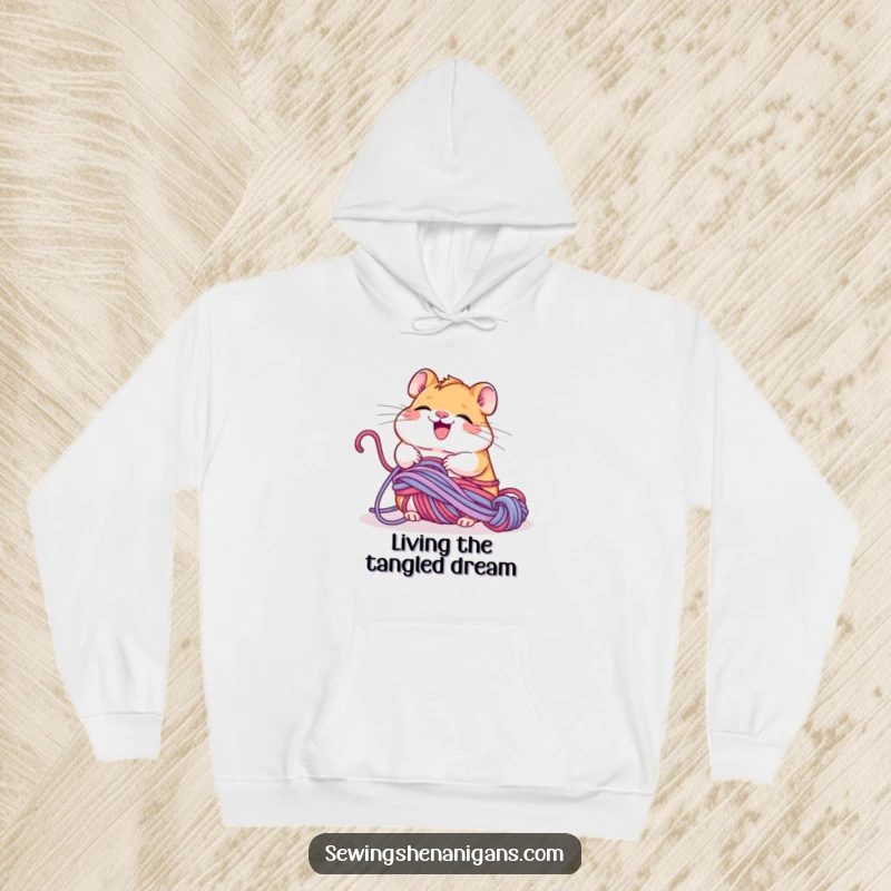 Funny giggling hamster tangled in yarn, happily unravelling it, a comfortable and humorous hoodie for knitters.