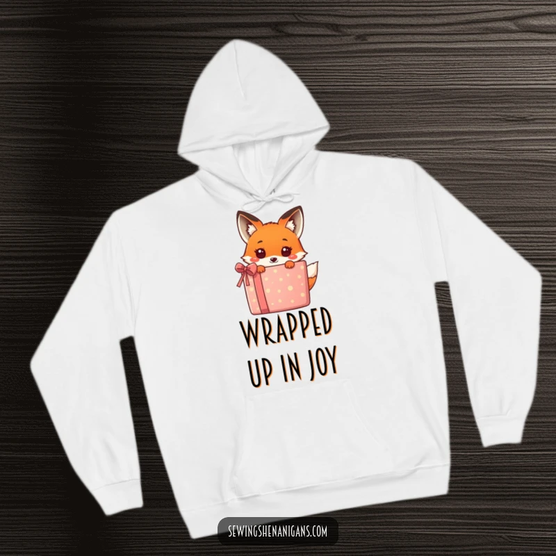 Funny kawaii fox hiding behind a huge, bright gift box, offering a humorous and adorable look on this cozy hoodie.
