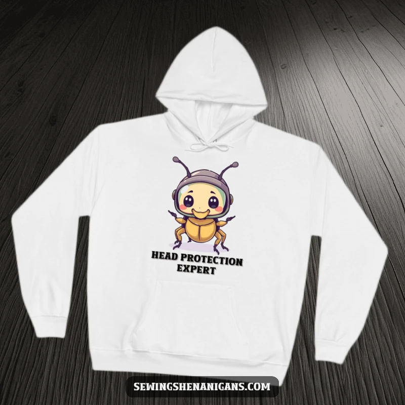 Funny hoodie featuring a bewildered beetle character wearing a thimble as a helmet, offering a cozy and humorous protective feel.