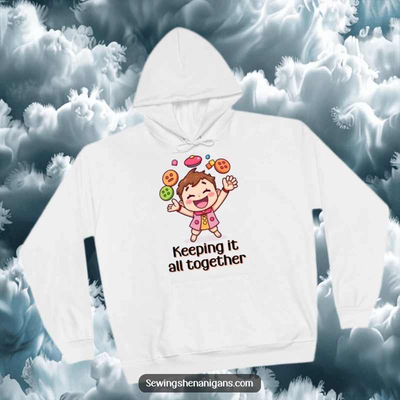 Funny hoodie depicting a happy character expertly juggling colorful buttons, providing warmth and a dose of crafting humor.