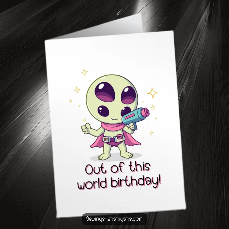 Funny Free Printable Birthday Card: A kawaii alien waves a ray gun shooting colorful sparkles, celebrating a birthday with cosmic flair.