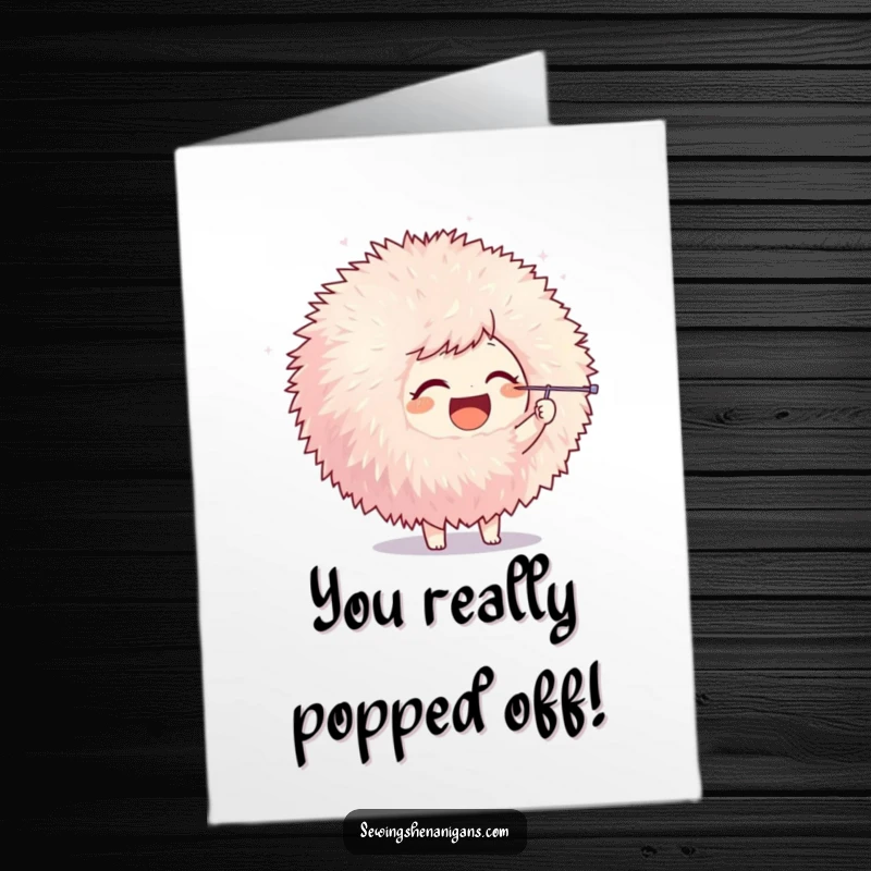 Funny Free Printable Congrats Card: Joyful character playfully poking a giant pom-pom with a needle, celebrating accomplishment.
