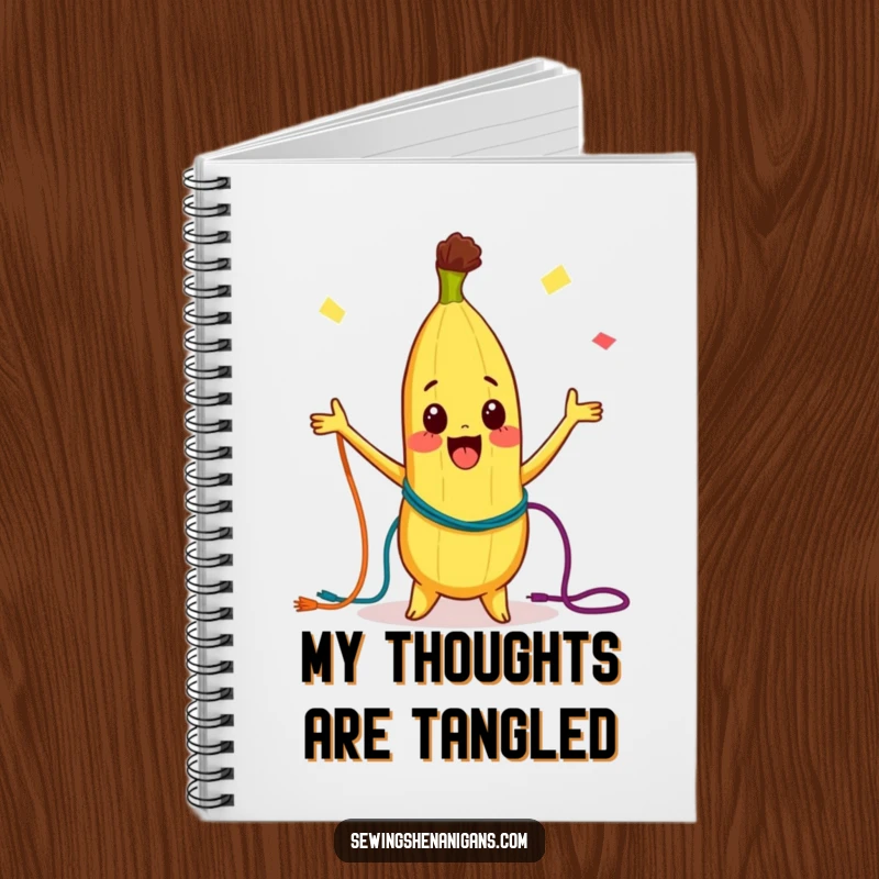 Funny Notebook: A curious banana character joyfully juggling colorful threads, perfect for capturing ideas with a burst of whimsical fun.
