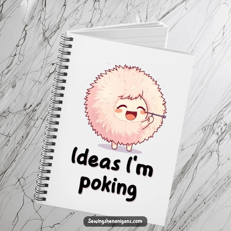 Funny notebook with a joyful character poking a giant pom-pom with a needle, perfect for notes and creative inspiration with humor.