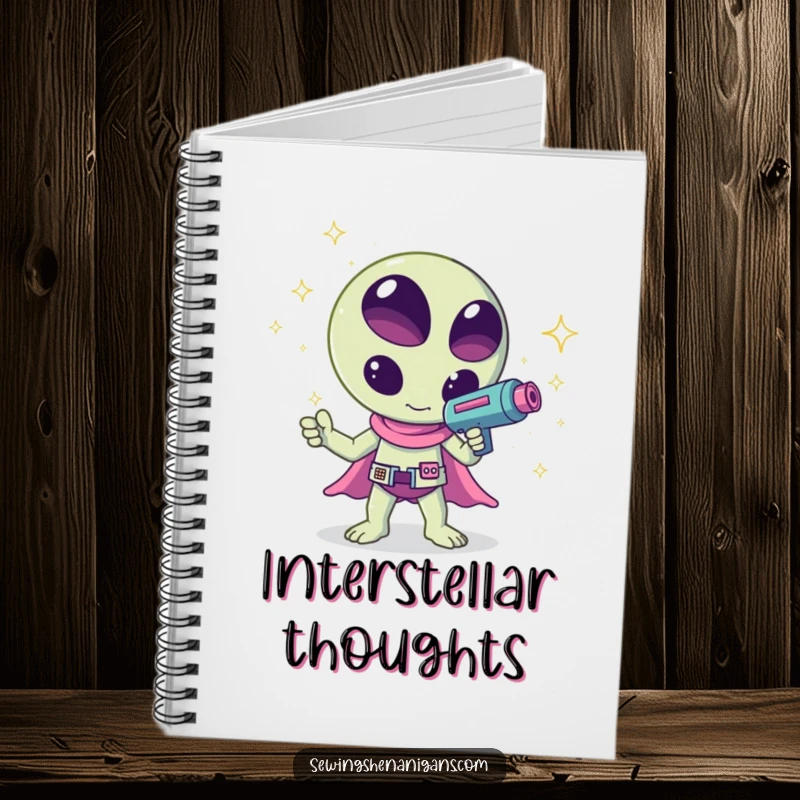 Funny kawaii alien waving a ray gun that shoots sparkles, a humorous and cute design on this notebook, perfect for jotting notes.