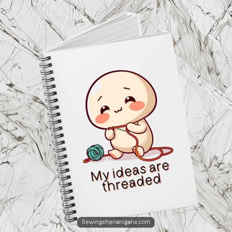 Funny notebook featuring a giggling needle character enthusiastically threading colorful string, for jotting down creative ideas.